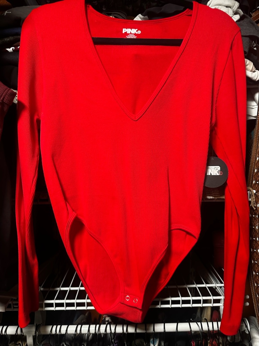 Red v-neck body suit